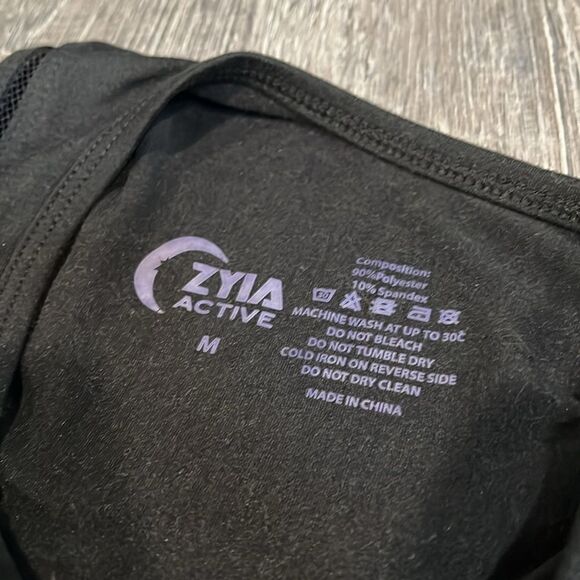 ZYIA Active soft stretch black top with mesh scoop bottom like new - M - Picture 10 of 10